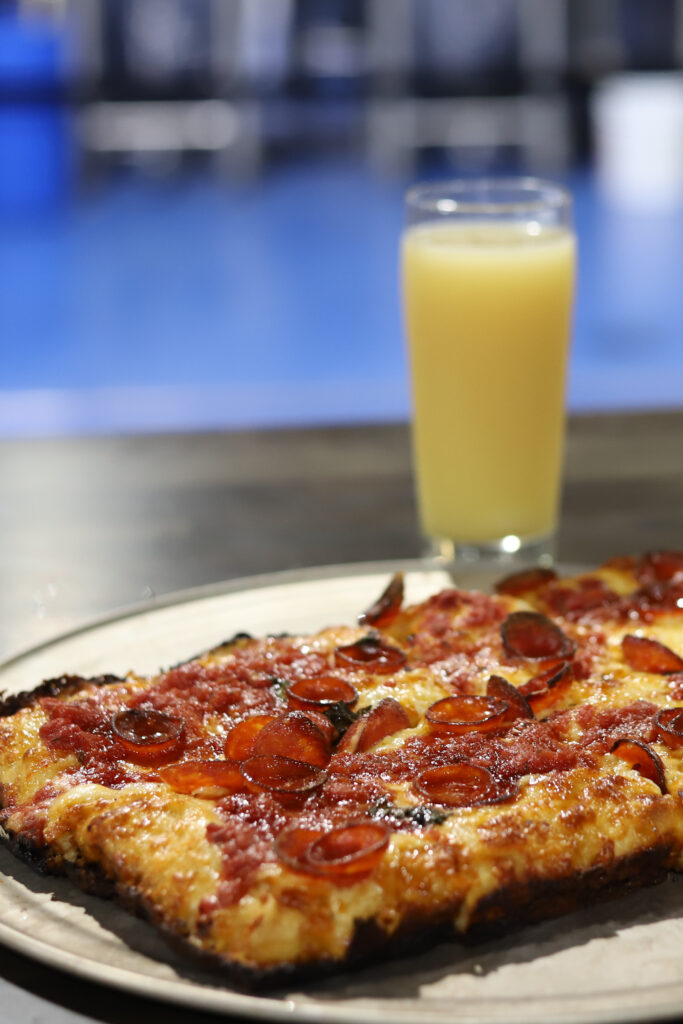 Pepperoni pizza with a beer